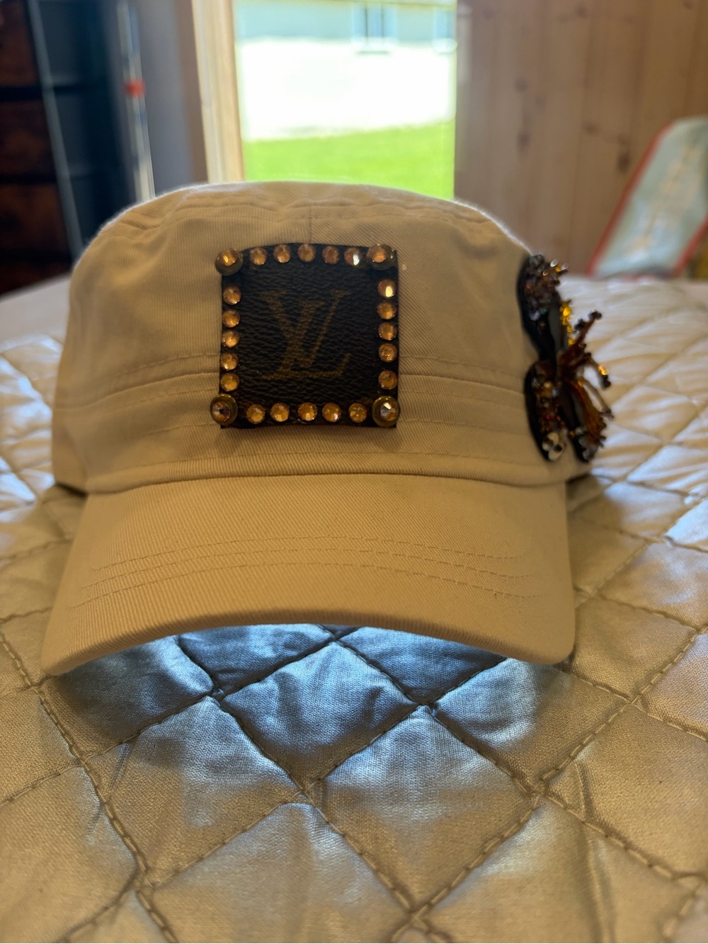 Baseball cap with upcycled Louis Vuitton monogram patch and decorative bling
